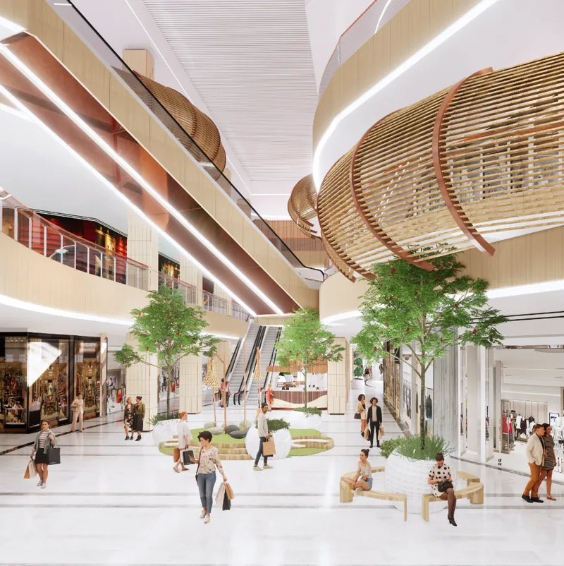 Interior atrium of PH Eco Mall with escalators, indoor trees and woven rattan ceiling pods