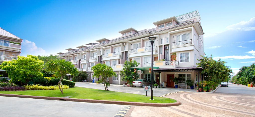 Completed three-storey link villas along a landscaped internal road at The Star Platinum