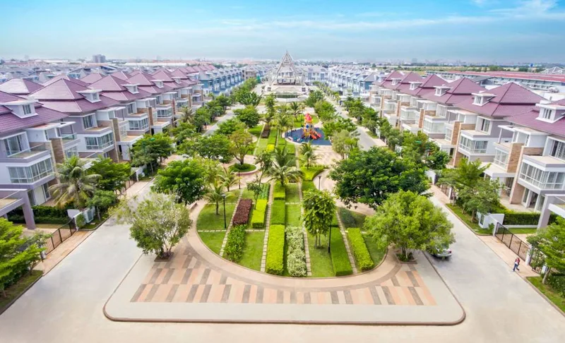 Aerial view of villa streets and a central garden park at The Star Premier