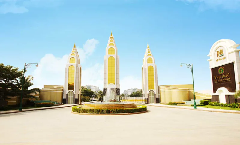 The Star Premier entrance gate with its three golden spires and central fountain, Russey Keo, Phnom Penh