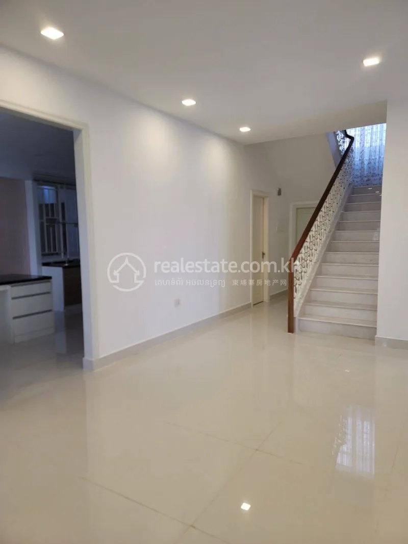 Interior living area with marble staircase inside a Park Land Sen Sok villa