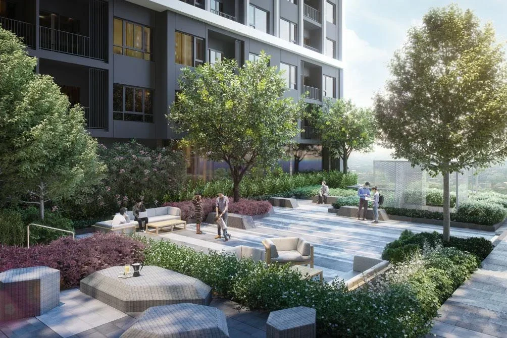 Street-level view of landscaped roads and villa frontages at Park Land TK