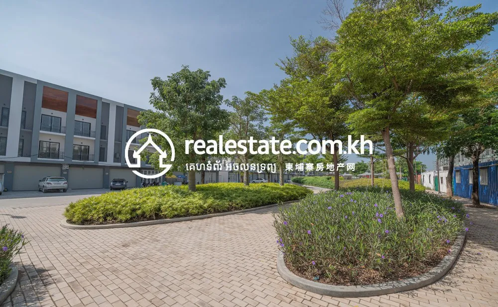 Landscaped central garden bed among ARATA Garden Residences homes