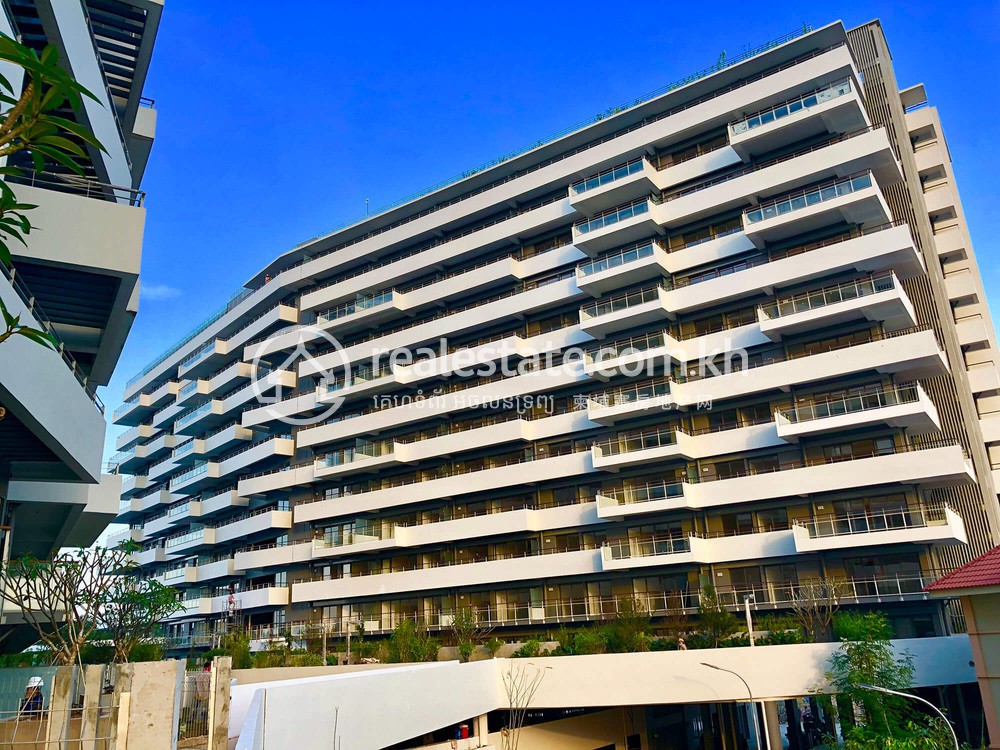 Bodaiju Residences condominium viewed from across its forecourt under blue sky
