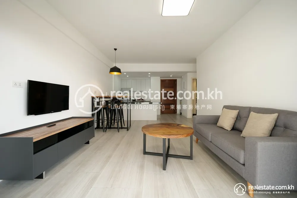 Open-plan living and dining area with kitchen in a Bodaiju Residences unit