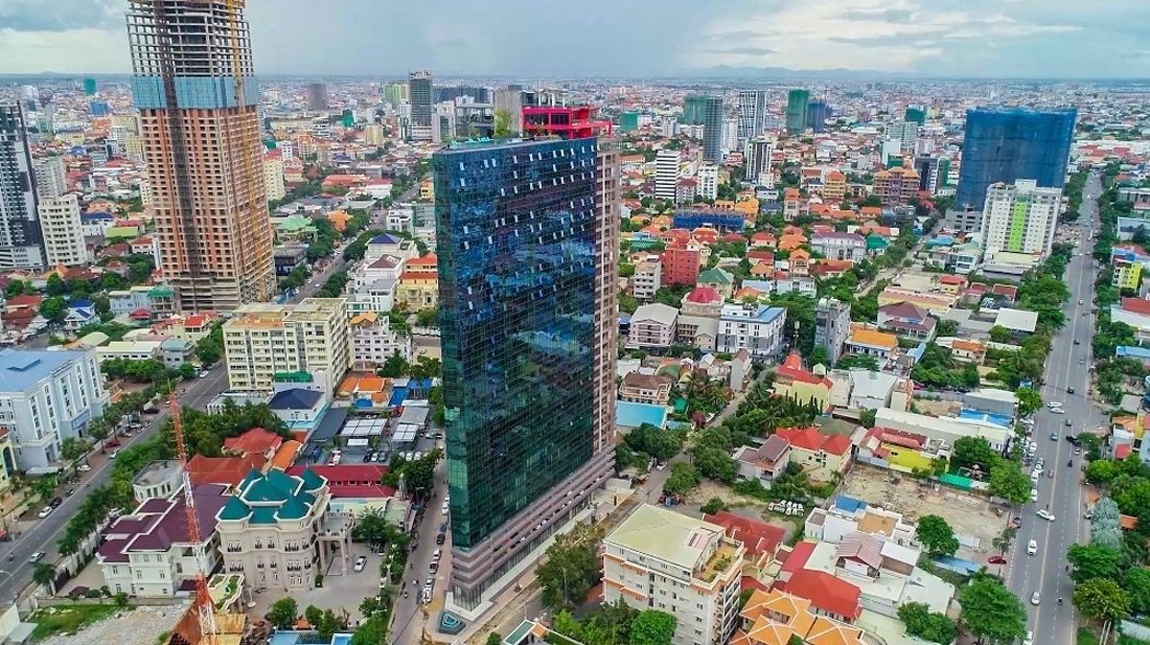Time Square 3 glass condominium tower rising above the Toul Kork skyline in Phnom Penh
