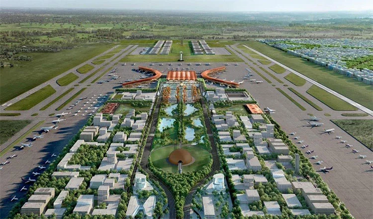 Wider aerial shot of Techo International Airport showing the apron, taxiways and outlying development zones