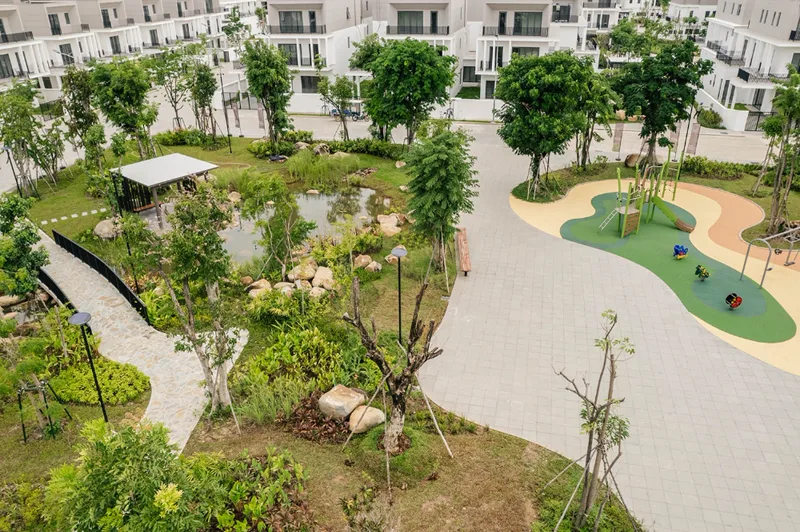 Borey Chankiri central park with a landscaped creek pond, walking paths and children's playground