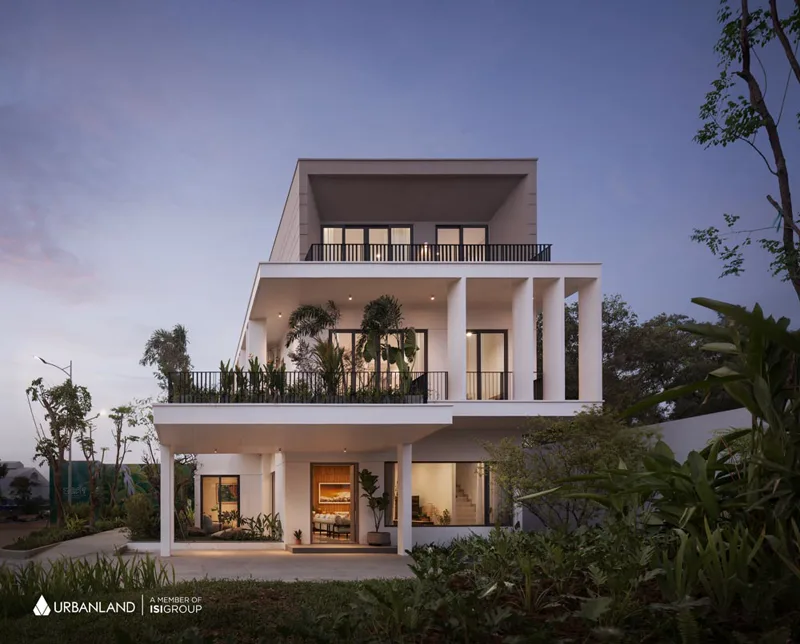 Completed Borey Chankiri villa photographed at dusk with planted terraces and warm interior lighting