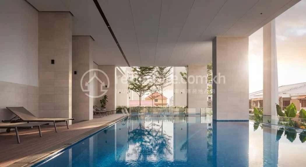 Embassy Central amenity pool with sun loungers and stone-clad deck, BKK1 Phnom Penh