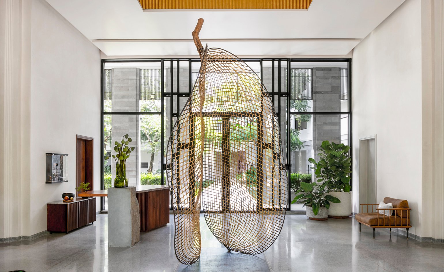 Treeline Urban Resort lobby with woven sculpture, Siem Reap
